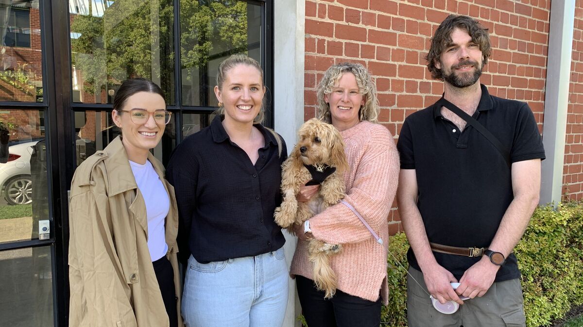 Our new Geelong team members Riley Danaher, Sam Croxford, Tess Dolman and Andrew Howe with Huxley the Cavoodle.