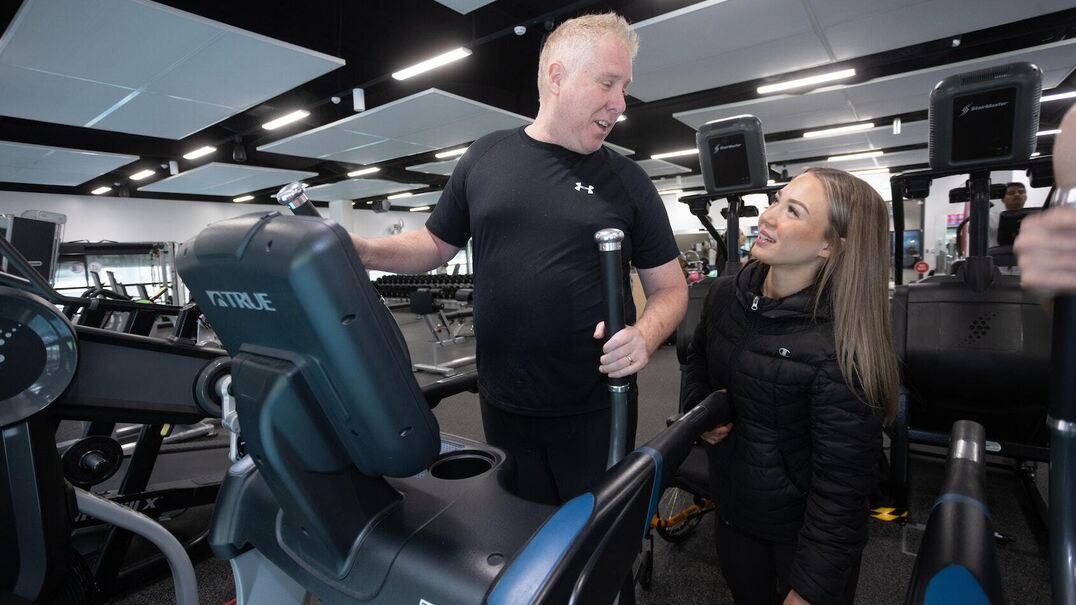 InLife support worker Caity with client Neil at the gym.